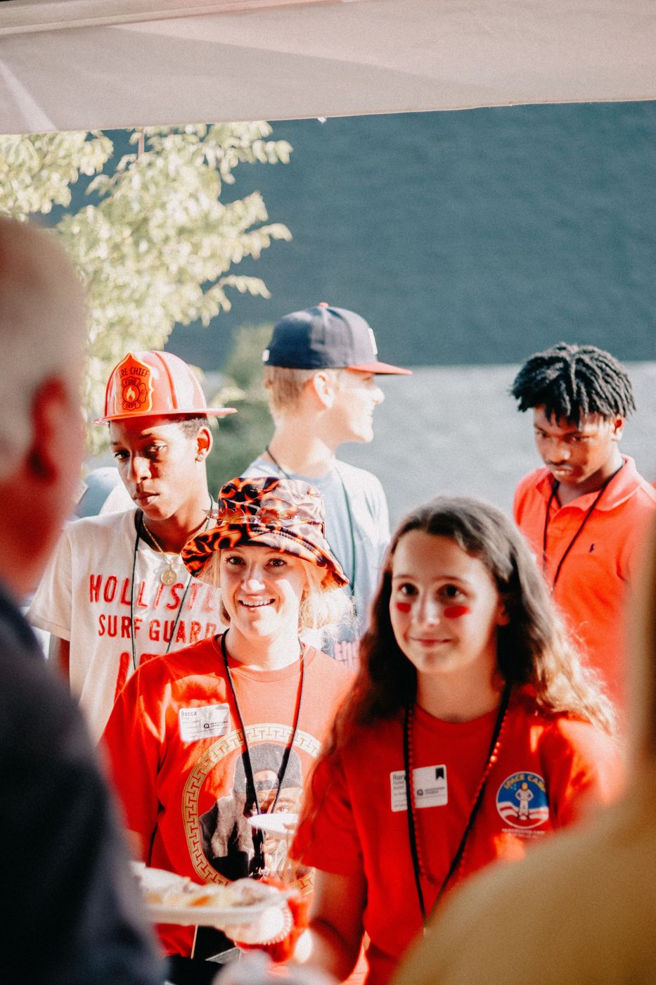 Smiling young people in line at a community meal